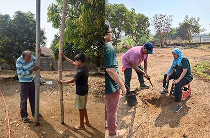 Volunteers planting saplings as part of the Hirwa Swapna green initiative
